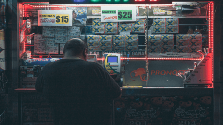 man playing at the lottery